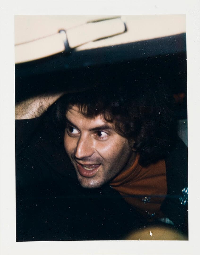 Unidentified Man (Dark Curly Hair)